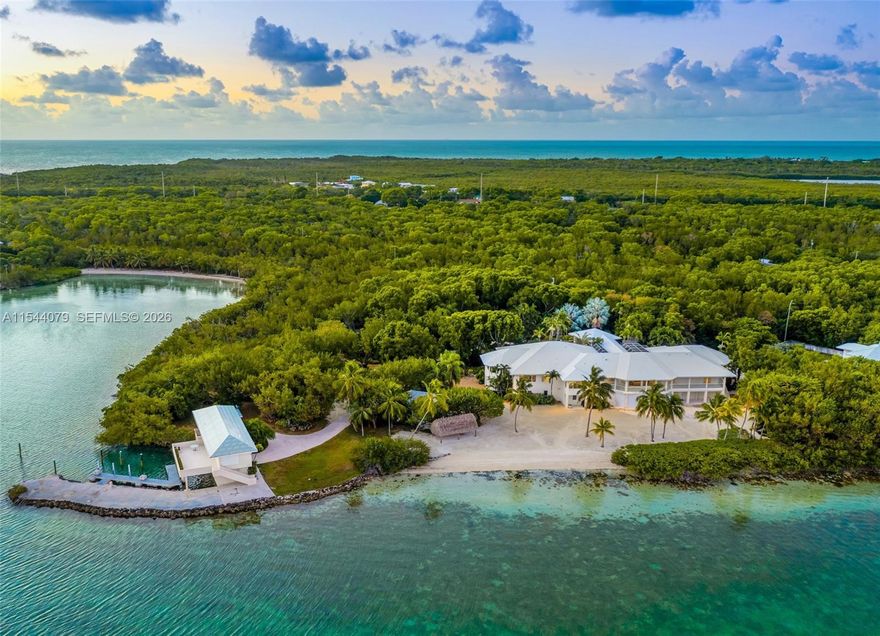 Experience Absolute Paradise! A Legacy Florida Keys Estate offering ultimate privacy & tranquility. The Orchid Cove Estate spans 14.5 Acres offering 1,000 ft. of waterfront & Private Beaches accessed through a grand entrance surrounded by a breathtaking canopy of exotic trees.  Award winning Botanical gardens surround the property featuring impeccably curated nature trails leading to the main house, a boathouse, guest villas, & beach cove. Main residence rises 10 ft above the ground level, entered through a footbridge surrounded by coral rock waterfalls & koi ponds.  Expansive water views, Library, Theater, Spa & Wellness room, Elevator & Chef’s kitchen, private boat dockage,10+ car garage, catering facilities, generator & more. Daily spectacular sunsets. Arrive by seaplane, boat, or car.