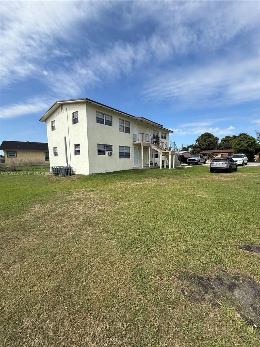 Photo of 124 NW 12th Dr, Belle Glade, FL 33430 (MLS # A11750356)
