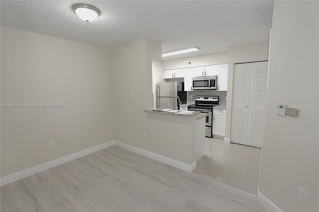 Photo of 2820 N Oakland Forest Dr #109, Oakland Park, FL 33309 (MLS # A11883086)