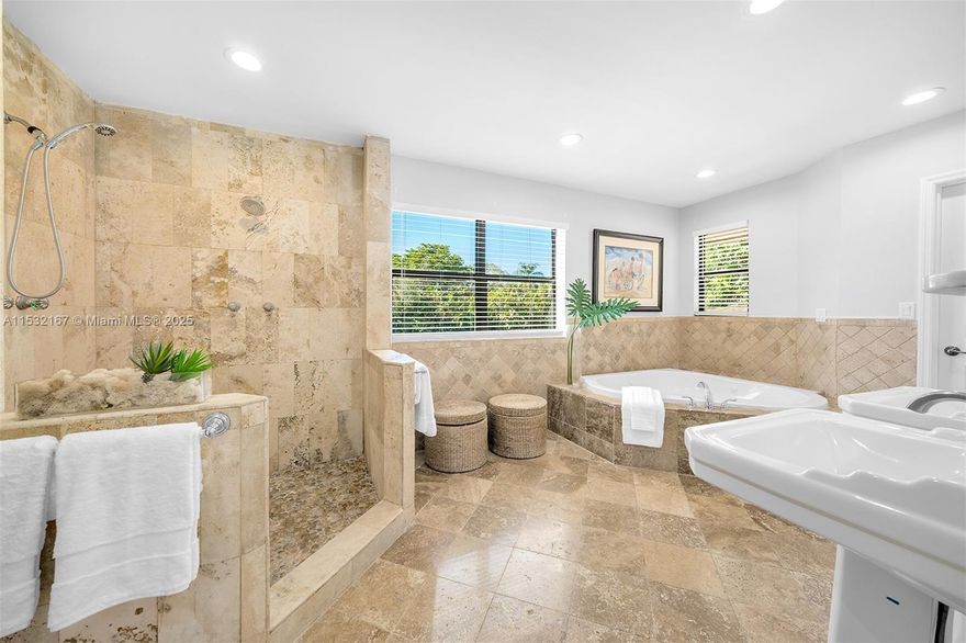 Nestled in Pinecrest, this traditional charm w modern updates estate graces a stunning 1.5-acre gated lot. The 2-story residence boasts 8 beds & 6.5 baths. The main level showcases formal living & dining spaces, updated chef's kitchen w wd cabinetry, cooking island, & a breakfast nook. The family rm w a fireplace, flows seamlessly into the FL rm, offering views of the backyd. High ceilings, impact windows & drs, & recently installed roof. Upstairs, discover 5 beds, including a primary suite w sitting area, as well as a game rm. Downstrs, 2 bedrooms with en suite bathrooms form a guest wing. Outside, indulge in the sprawling lawn, pool, & travertine patio, alongside a separate 1/1 guest house. The estate includes a koi pond, basketball court, and 2-car garage. Proximity to elite schools.