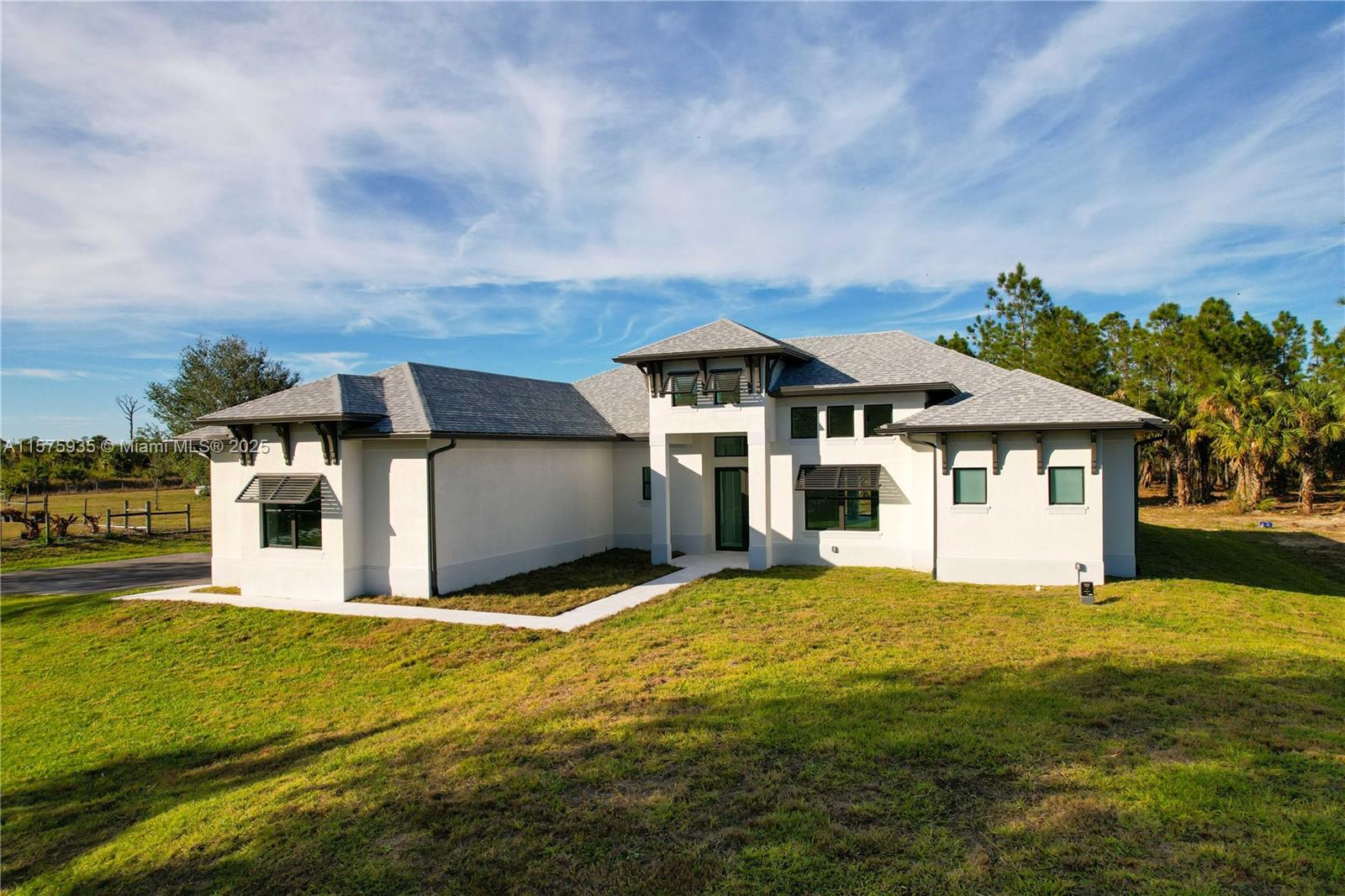 **BUILDER IS GIVING $20,000 BUYER CREDIT** LUXURY MEETS ESTATE LIVING! NEW CONSTRUCTION - ETA COMPLETION DATE: Q3 of 2024. This beautiful 3+ Den, 3 bath, 2387 Sq. Ft. home on 100% UPLANDS features many upgrades; 42" white WOOD kitchen cabinets, QUARTZ countertops in kitchen & bathrooms, extra-large kitchen island, 24x24 PORCELAIN TILE throughout, stainless steel appliances, French door refrigerator, 30" electrical cooktop, combination wall oven and microwave, laundry in residence, ZERO CORNER SLIDING GLASS DOORS, SCREENED PAVED LANAI, PAVED ENTRYWAY, pool bath, 3-car garage, IMPACT windows, 5 1/4" baseboards, elevated tray ceilings, sprinkler system with automatic timer and much more! Spacious Master Bedroom with walk in closets and double sinks.