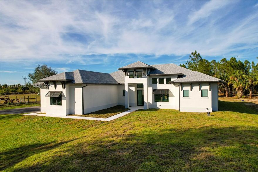 **BUILDER IS GIVING $20,000 BUYER CREDIT** LUXURY MEETS ESTATE LIVING! NEW CONSTRUCTION - ETA COMPLETION DATE: Q3 of 2024. This beautiful 3+ Den, 3 bath, 2387 Sq. Ft. home on 100% UPLANDS features many upgrades; 42" white WOOD kitchen cabinets, QUARTZ countertops in kitchen & bathrooms, extra-large kitchen island, 24x24 PORCELAIN TILE throughout, stainless steel appliances, French door refrigerator, 30" electrical cooktop, combination wall oven and microwave, laundry in residence, ZERO CORNER SLIDING GLASS DOORS, SCREENED PAVED LANAI, PAVED ENTRYWAY, pool bath, 3-car garage, IMPACT windows, 5 1/4" baseboards, elevated tray ceilings, sprinkler system with automatic timer and much more! Spacious Master Bedroom with walk in closets and double sinks.