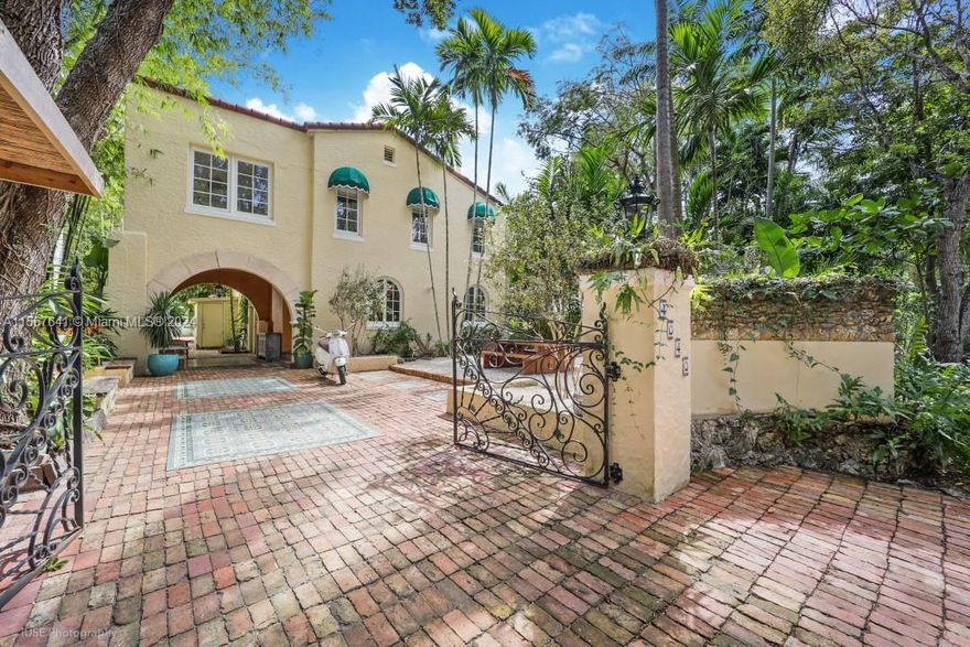 Nestled in the heart of South Grove, this renovated Spanish Revival 4 bedroom, 3 bathroom villa blends historic authenticity with contemporary comfort. Discover original arched windows, oak floors and Moroccan zellige tile detailing throughout the house. Entertain effortlessly in the open-plan layout, where the kitchen flows seamlessly to a sun-drenched backyard oasis, complete with a salt water solar heated pool and outdoor shower. The flexible floor plan includes a dining room and an additional family room upstairs, providing versatile living spaces for your needs. Surrounded by lush tropical landscaping, this home is a sanctuary just steps from the vibrant Village of Coconut Grove. Explore boutiques, cafes, and bayfront parks in this charming neighborhood.