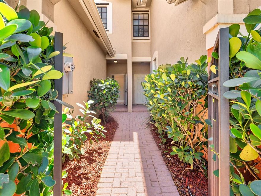 Charming 2-bedroom, 2.5-bath townhouse located in the desirable Courtyard at the Grove, just steps from the community pool and playground. This well-maintained home features a spacious great room with living and dining areas, highlighted by stylish laminate wood-look flooring and sliding doors that open to a covered patio. Enjoy a peaceful green space view with no rear neighbors perfect for relaxing or entertaining. The kitchen overlooks the main living area and it features stainless steel appliances, including a newer refrigerator, granite countertops eat-in area and snack bar, making it ideal for everyday living. Upstairs, the primary suite offers a private bath and walk-in closet, while the second bedroom is thoughtfully split for added privacy and includes access to its own full bathroom, ideal for guests, family, or a home office setup. Freshly painted. Pet friendly! Investors welcome and unit can be rented the first year of ownership. It is possible to purchase w/cash, conventional, VA or FHA financing. Located in a sought-after neighborhood zoned for highly rated schools, with convenient access to shopping, dining, and major highways. Don’t miss this opportunity!