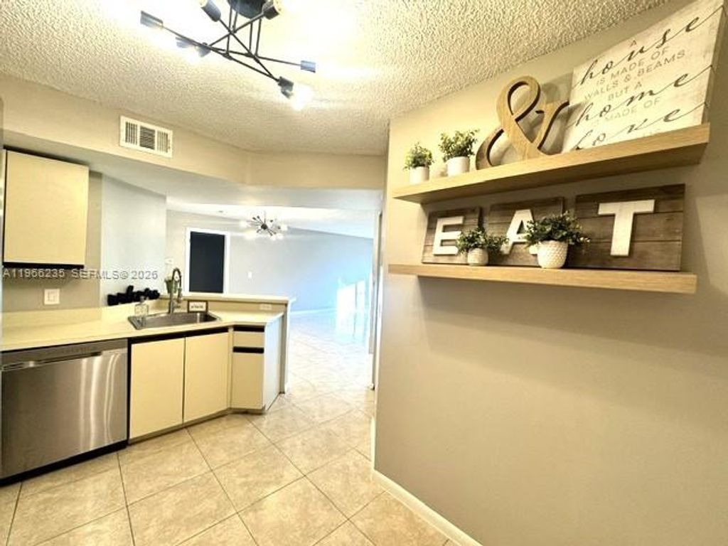 Photo of 8761 Wiles Rd #102, Coral Springs, FL 33067 (MLS # A11966235)