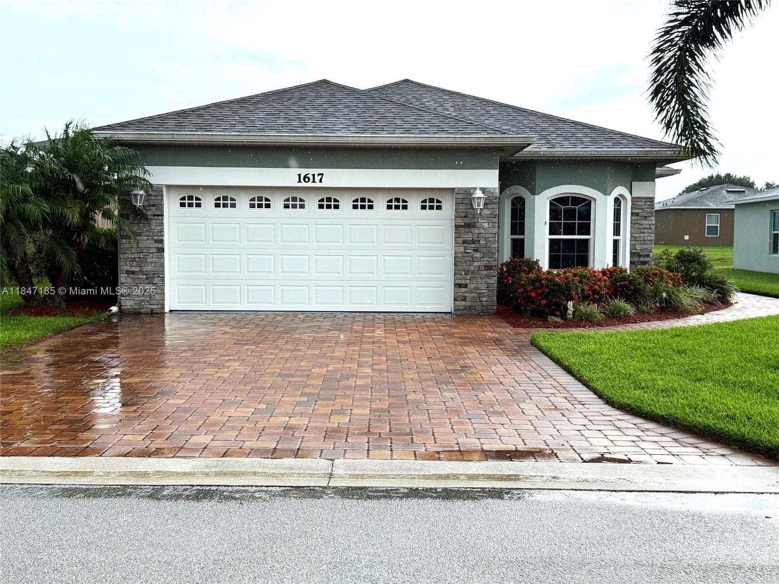 Welcome to the beautiful Stone Ridge community and all it has to offer! Residents enjoy access to a community pool and hot tub, a clubhouse with a full kitchen, a fitness room, and entertainment spaces featuring billiard and card tables—perfect for social gatherings and relaxation. This 3-bedroom, 2-bathroom home is an original builder model with a flexible layout. One of the bedrooms features glass door that open to the main living area, making it ideal for a home office. The interior showcases tile and newly installed carpet flooring, high ceilings, freshly painted walls, and a split floor plan that offers privacy and functionality. Enjoy natural light year-round in the inviting sunroom, perfect for morning coffee or quiet reading.
