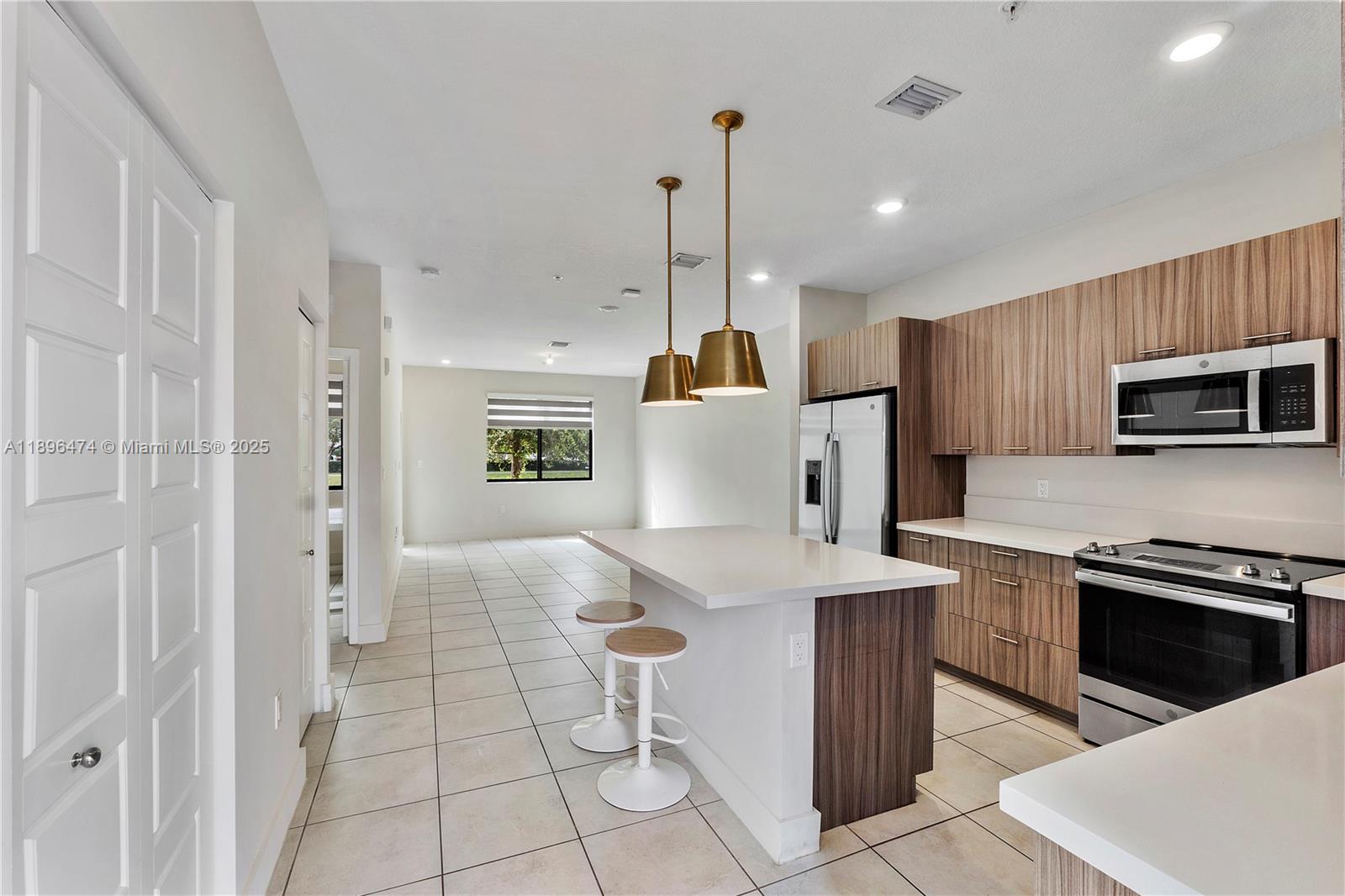 Modern comfort meets family-friendly living in an unbeatable location in Downtown Doral! Beautifully designed spacious two story condo townhome with open layout, quartz kitchen countertops, stainless steel appliances, impact windows, tile downstairs, laminate flooring upstairs and assigned parking. Features one bedroom one bath downstairs and three bedroom, two bath upstairs including a spacious primary suite with walk-in closet, dual-sink, oversized shower & private balcony. Resort-style amenities include pool, fitness center, indoor basketball court, clubhouse, kids’ play zones & more. Prime location near CityPlace Doral, top-rated schools & MIA Airport, welcome home to Urbana at The Residences!