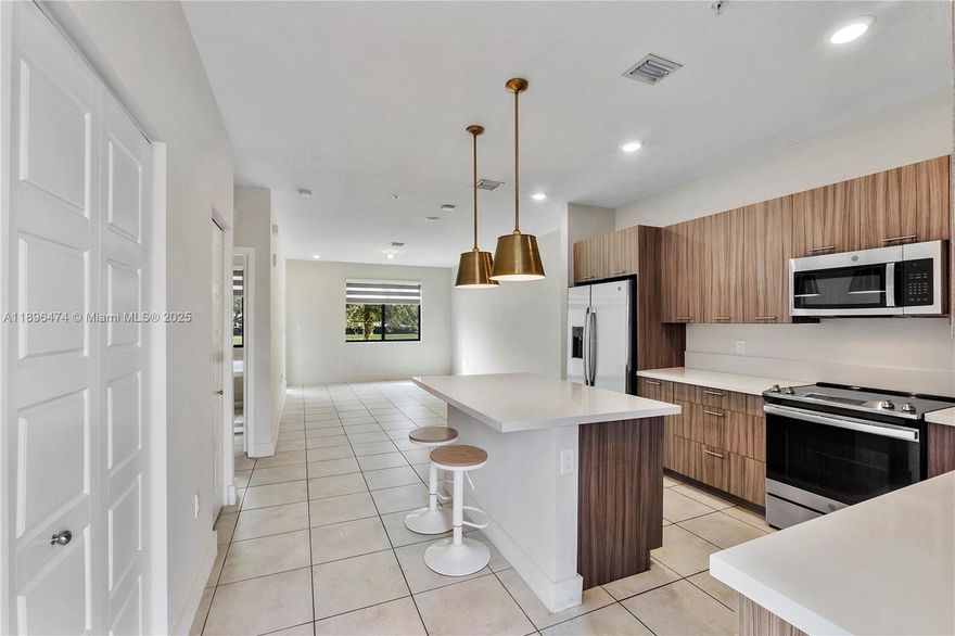 Modern comfort meets family-friendly living in an unbeatable location in Downtown Doral! Beautifully designed spacious two story condo townhome with open layout, quartz kitchen countertops, stainless steel appliances, impact windows, tile downstairs, laminate flooring upstairs and assigned parking. Features one bedroom one bath downstairs and three bedroom, two bath upstairs including a spacious primary suite with walk-in closet, dual-sink, oversized shower & private balcony. Resort-style amenities include pool, fitness center, indoor basketball court, clubhouse, kids’ play zones & more. Prime location near CityPlace Doral, top-rated schools & MIA Airport, welcome home to Urbana at The Residences!
