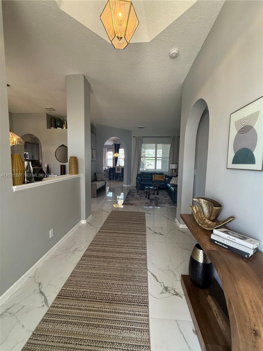 Photo of 5711 NW Zenith Dr, Port St Lucie, FL 34986 (MLS # A12021327)