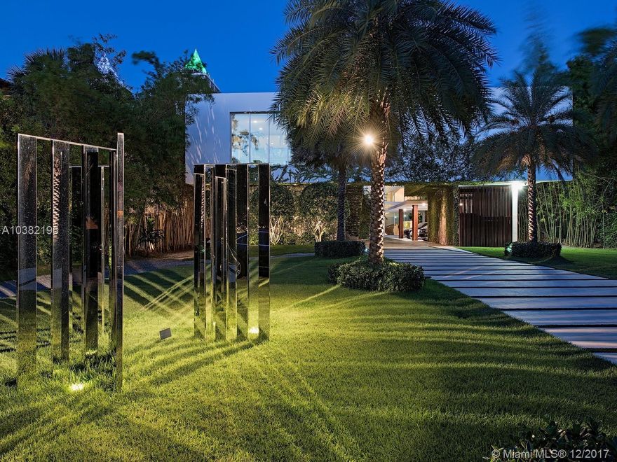 Ultra-chic residence, inspired by Le Corbusier designed for the most discerning buyer. One of the only estates on Pine Tree drive with direct ocean views, sitting on an acre of land on the wide portion of the intercostal. Designed by world-renowned architect Kobi Karp, this home is set back from the street by a long deep driveway. Spiral staircase modeled after the Guggenheim Museum leads to rooftop terrace with 360-degree views of Miami's skyline. Chef's kitchen, fully equipped 10 seat home theater and separate state of the art fitness center. Patio area with seamless edge heated salt water pool with integrated spa and summer kitchen. Separate guest house and a half basketball court overlooking the water. Centrally located, minutes from the beach,restaurants, hotels and clubs.