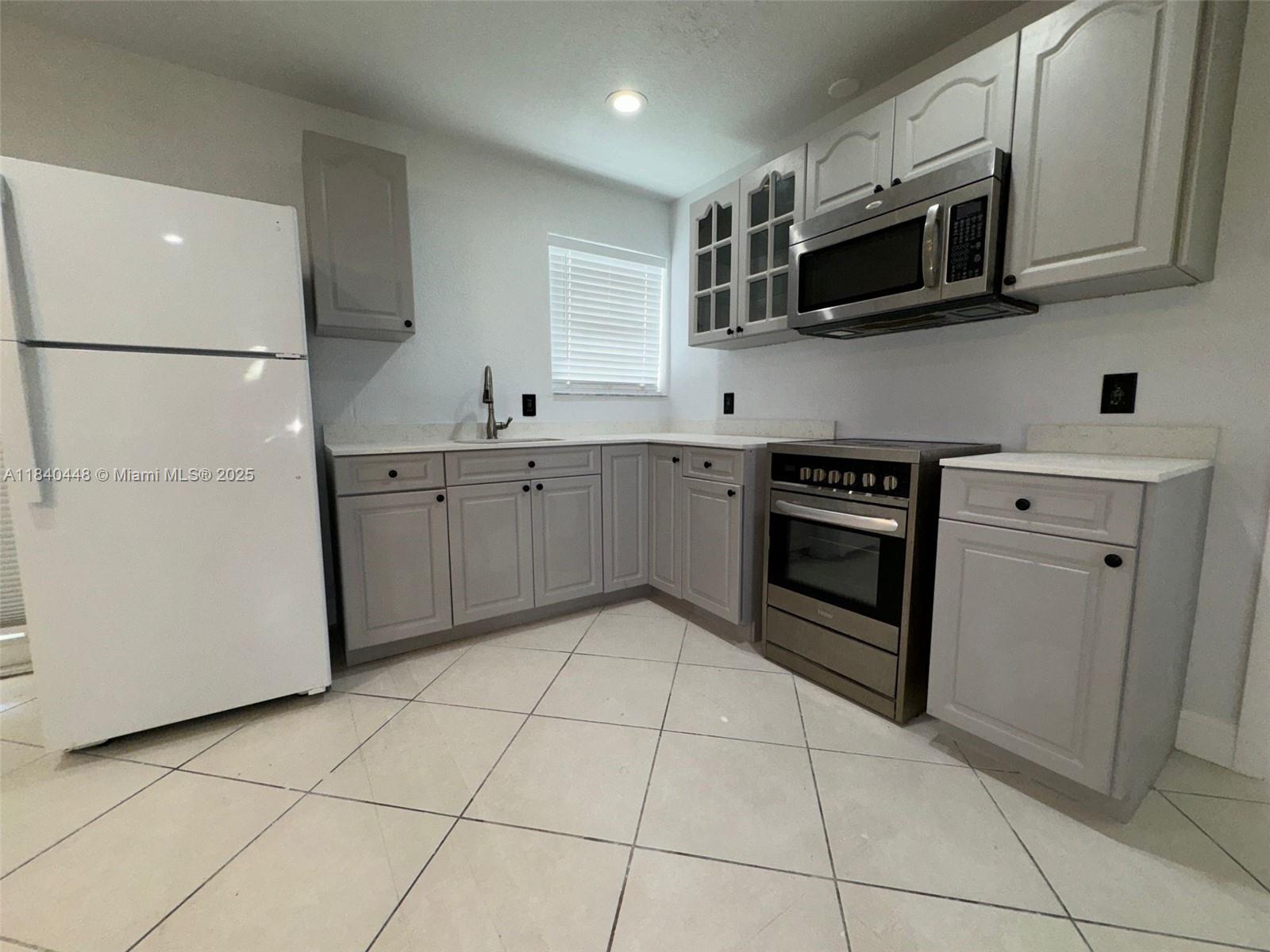 Charming and move-in ready, this 3-bed, 2-bath + extra room home is nestled in the fast-growing Melrose Manors. Enjoy an open-concept living/dining area, modern kitchen with quartz countertops and stainless steel appliances. The private master suite features a walk-in closet, en-suite bath, and direct backyard access. A flexible 4th room is perfect as an office or playroom, with a large connected laundry room. Close to new shops, schools, parks, and major roads—this home offers comfort, style, and convenience in one perfect package!