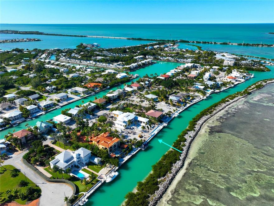 Welcome to an extraordinary opportunity to own a BRAND NEW construction estate on one of Duck Key's RARE TRIPLE OCEANFRONT parcels—a masterpiece designed for refined island living and world-class waterfront enjoyment. This estate under construction offers five bedrooms and six full baths, totaling 6,391 sq ft under air (3,893 sq ft first floor, 2,498 sq ft second), plus a 959 sq ft elevated, climate-controlled garage. A private elevator serves all levels; the custom gym converts to a sixth bedroom or guest suite. It boasts 138 FEET OF DEEPWATER OCEAN FRONTAGE along a protected flow-through canal, with concrete seawall, direct ocean access, tackle room, and cabana bath. Outdoor living includes an infinity-edge heated/chilled pool with jacuzzi, elevated covered bistro deck (grill, refrigerator, deep-fry burner, bar seating), expansive entertaining spaces, luxury roll-down electric shutters for comfort, security, and privacy, and an exterior gas fireplace. The chef’s kitchen features high-end Viking stainless appliances, Miele coffee maker, quartz countertops with island seating, and full butler's kitchen. Interiors showcase wood floors, coastal palette (white, Sea Salt blue, warm browns), two gas fireplaces, oversized laundry with double-stacked LG washer/dryer, walk-in closets, and five-zone A/C. The total list of luxury features is long. Schedule a private showing today with The Brenner Scheel & Casey Team.