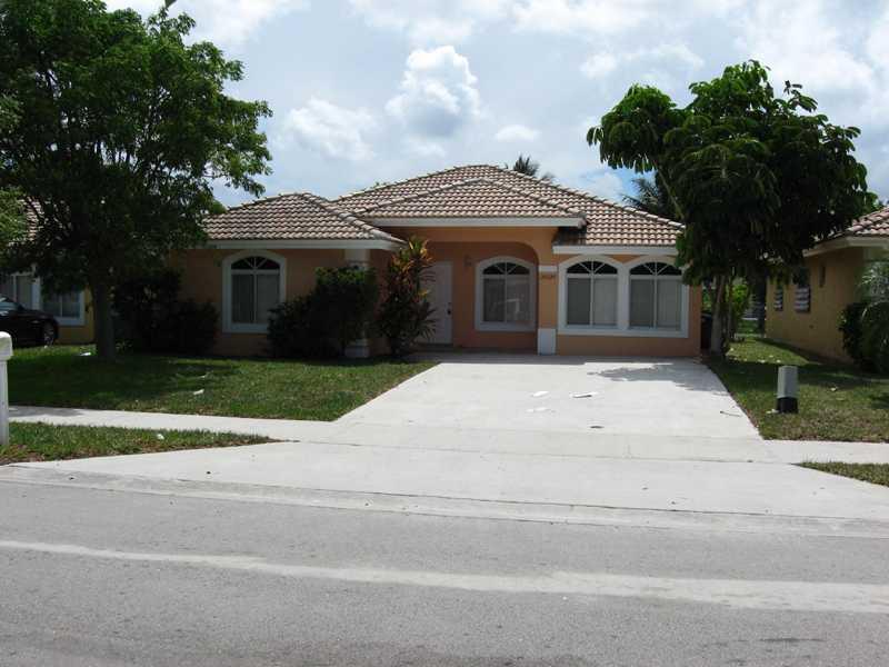 2006 BUILD SINGLE FAMILY HOUSE IN A VERY CALM MIAMI GARDENS NEIGHBORHOOD.LARGE 4 BEDROOMS, 2 BATHROOMS AND SPACIOUS LIVING. TILES AND WOOD FLOORS. 2014 APPLIANCES,NEW A/C AND LARGE LAUNDRY ROOM AND UPGRADED KITCHEN.