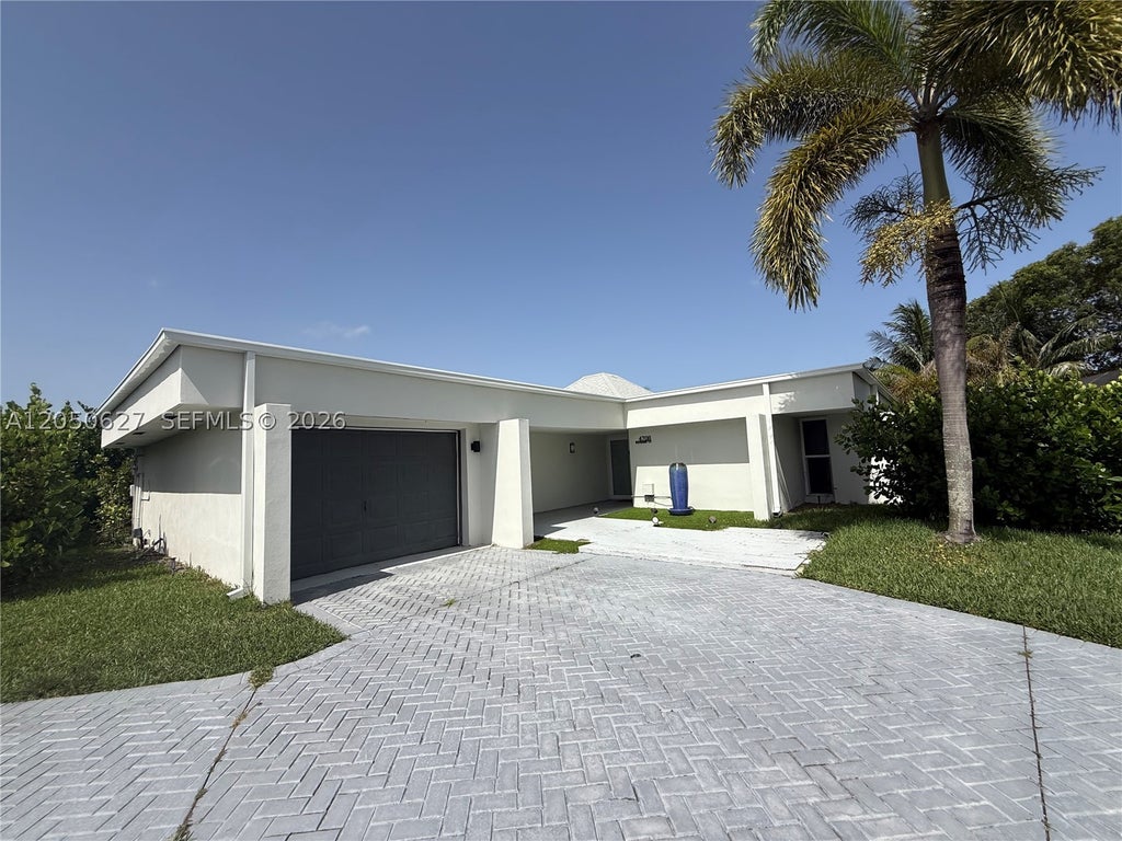 Photo of 4708 Bayberry Ln, Tamarac, FL 33319 (MLS # A12050627)