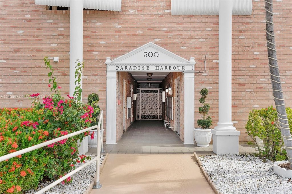 Photo of 300 Golden Isles Dr #209, Hallandale Beach, FL 33009 (MLS # A11408977)