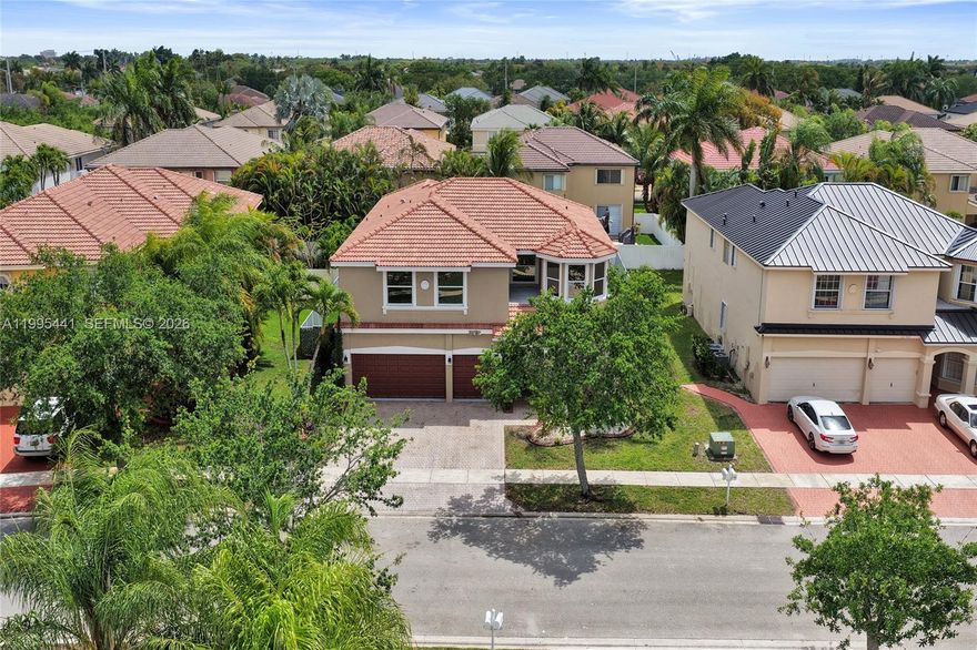 Navigate Home to this 5 bedroom 4 bathroom gated, pool home in the city of Pembroke Pines. Nestled in Harbourside Estates of the renowned Pembroke Shores master planned community. Home is one of the largest models in the area and great for multi-generational and growing families.  An airy open floorplan with over 3600 square feet under air that brings in a lot of natural sunlight. Fully remodeled with chef style kitchen, Dekowood accent walls featuring hidden door to full downstairs en suite, spa like bathrooms, glass staircases, large balcony off the master, and full impact hurricane protection. The backyard is great for entertaining with covered lanai, pool with hot tub and a personal putting green. Full custom HD camera and alarm system, 24 hour manned security. This home has it all and more.