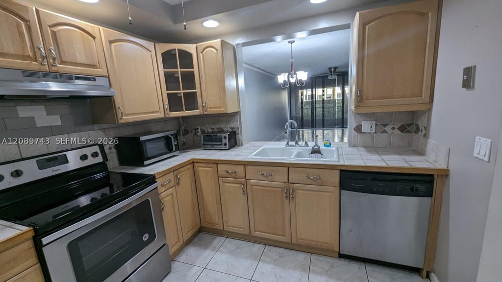 Photo of 8592 W Sunrise Blvd #105, Plantation, FL 33322 (MLS # A12089743)