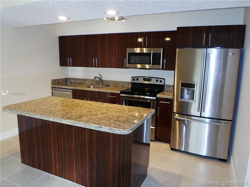 Gorgeous remodeled 1 bed 1 bath unit at Windward Lakes. Huge Modern kitchen with granite counter and island, custom cabinets, and stainless steel appliances. Tile and wood laminate floors. Updated bath with granite counter and modern finish. Washer/Dryer inside the unit. Your client will fall in love with it. Show and rent today!