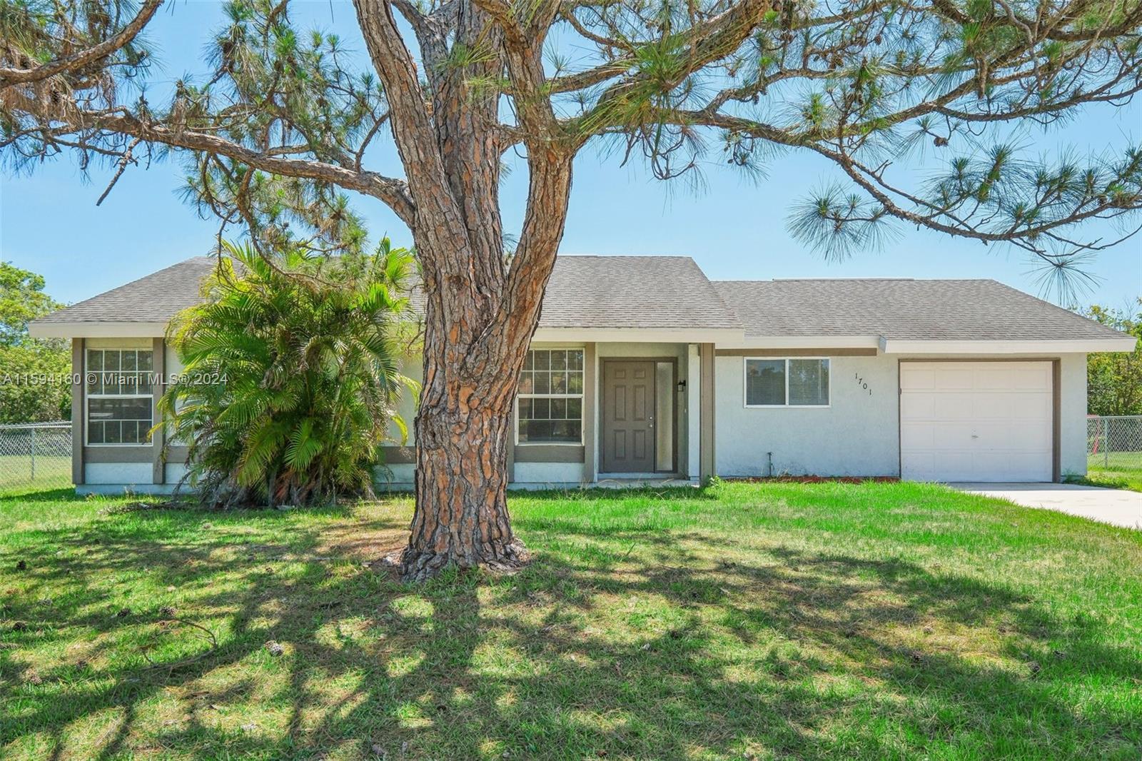 Nestled in the heart of Port St. Lucie, this lovely 3-bedroom, 2-bathroom home offers a perfect blend of modern elegance and timeless appeal. Step inside to discover the warmth of wood floors throughout, adding both style and durability to the living spaces.

The well-appointed kitchen features beautiful wood cabinets and sleek stainless steel appliances, creating a gourmet haven for culinary enthusiasts. Whether you're cooking up a feast for guests or enjoying a quiet meal with family, this kitchen is sure to inspire. Relax and unwind in the comfort of the bedrooms, where the rich wood floors continue to provide a sense of luxury and tranquility. The age of the roof is unknown, HVAC is 7 years, and water heater is 2 years.