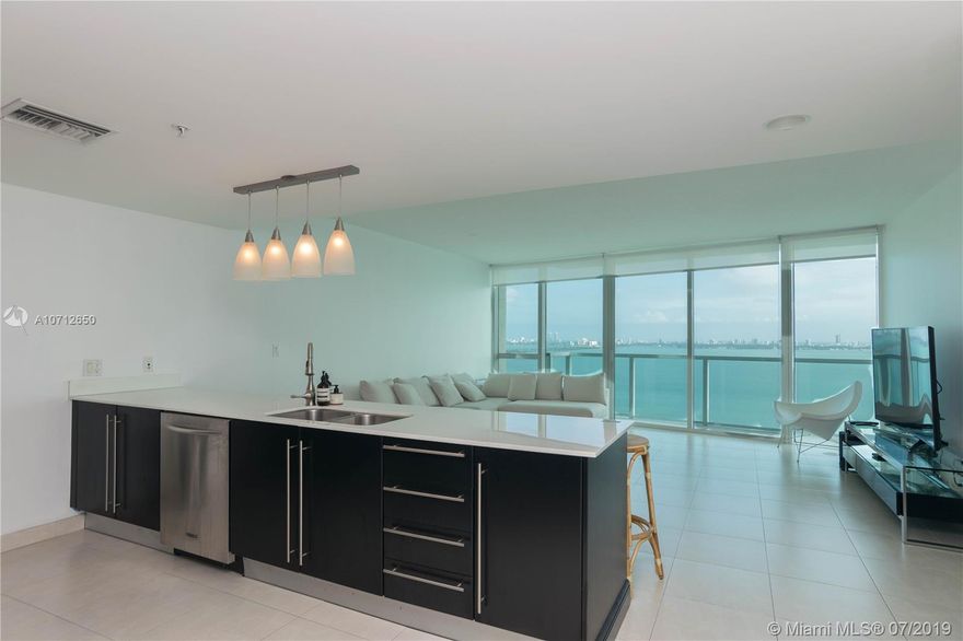 Amazing 1 bed, 1.5 bath with bay, ocean, miami port and city views. Granite counter tops and SS appliances Excellent amenities: pool, gym, sauna, steam room, party room, game room. Perfectly located: 5min drive to Miami Airlines Arena, Downtown, Wynwood, Midtown and Brickell.