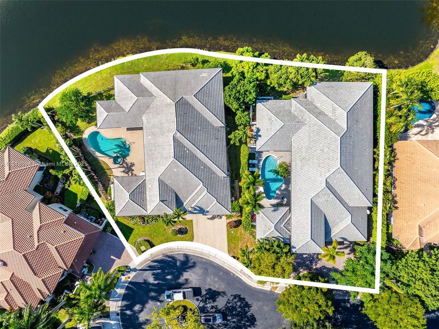 A rare architectural opportunity in the highly sought-after Seasons of Boca Raton: Two adjoining residences at 6451 and 6485 NW 32nd Way, offered together to create an expansive canvas of nearly 23,200 sq ft of combined land. Each home features 3 bedrooms plus a pool house/guest suite, for a total of 8 bedrooms and 8.5 bathrooms. The paired properties present an exceptional prospect for a private compound, multigenerational retreat, or bold, bespoke redevelopment—an uncommon convergence of space, flexibility, and potential.