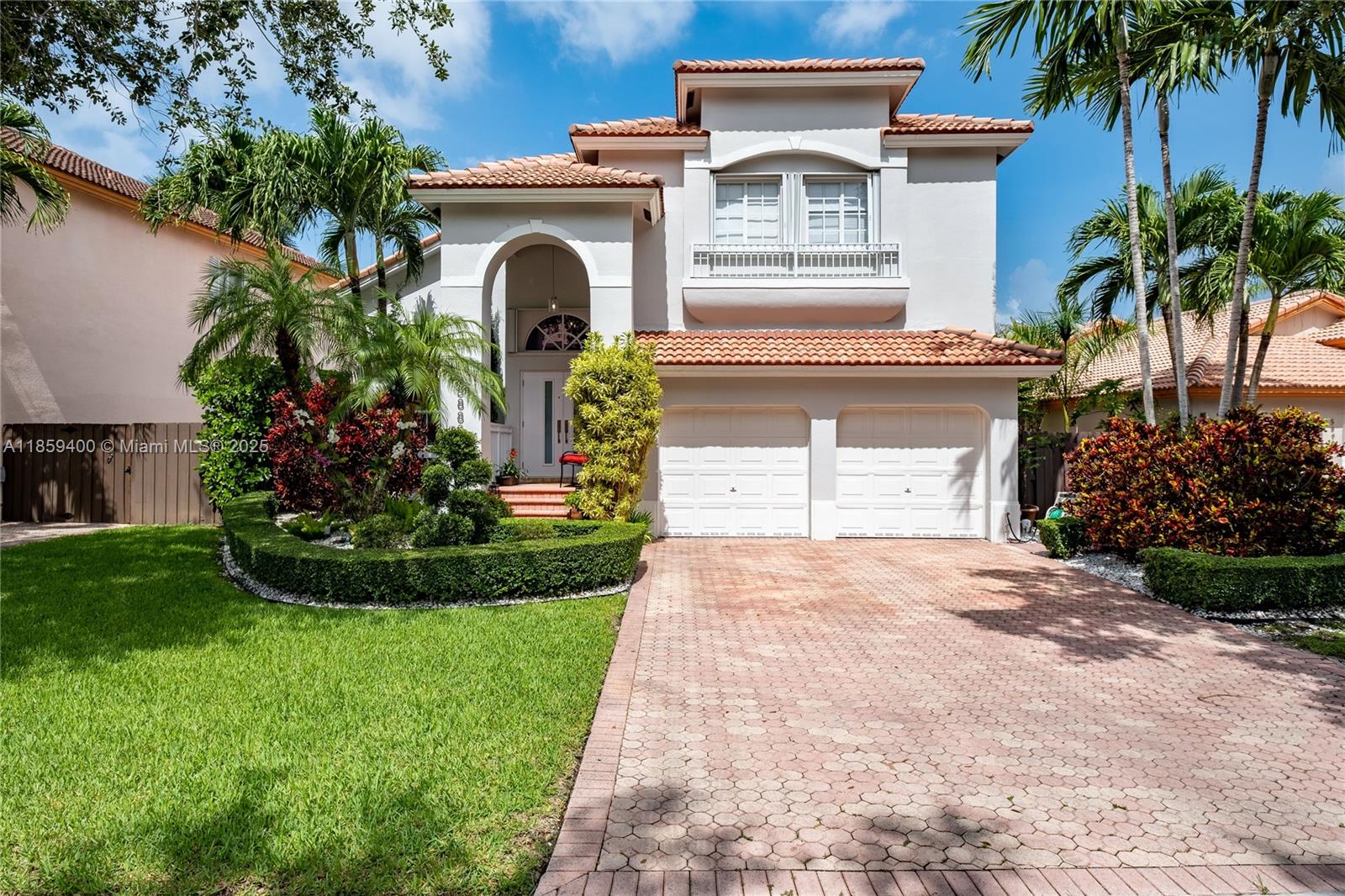 Stunning 4BR/3BA home in exclusive Doral Isles Antilles with 2,401 sq ft on a 5,945 sq ft lot. East-facing front adds light and curb appeal. The floor plan connects living, dining, family, and kitchen areas, creating inviting spaces for daily living and entertaining. Elegant ceramic/marble floors downstairs, wood upstairs, remodeled bathrooms, updated primary suite, and convenient ground-floor laundry. Accordion shutters, impact front door, newer A/C (3 yrs), heater, washer/dryer (7 yrs), paved driveway, and double garage. Expansive patio backs to a serene green space with no rear neighbors. Enjoy resort-style clubhouse, pools, gym, sports courts, and lake views—one of Doral’s most coveted communities. Virtual Tour: https://my.matterport.com/show/?m=2eYMZWb424p&mls=1