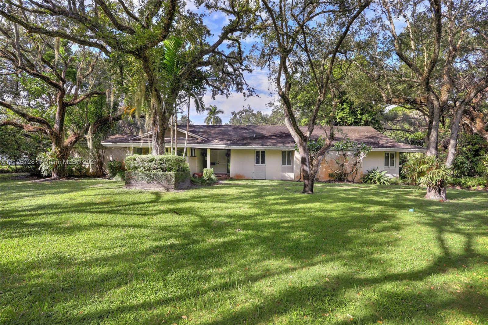 Situated among beautiful, gigantic oak trees, this stunning 51,000+ sf lot presents a golden opportunity for someone to either restore, renovate or rebuild the existing 4 bedroom, 4 bath home and pool house, complete with a full bathroom, or raze the existing house and build new. Ideally convenient to a collection of Dade County’s best schools and amenities, there could be no better opportunity! Snapper Creek Lakes not only boasts some of our county’s most beautifully presented large residences, it also offers a private marina for its residents’ use. Association membership is a prerequisite to purchase.