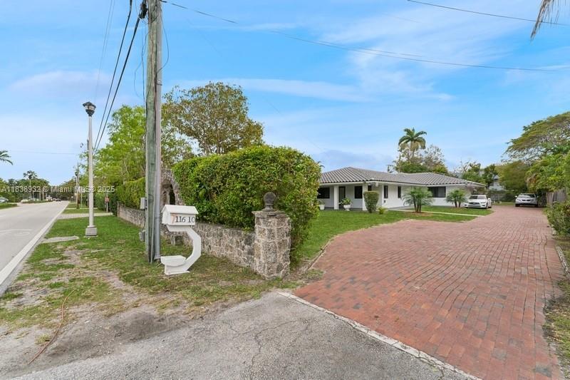 Exploring this amazing gem in the soul of the secluded Biscayne Park estate. This massive ranch style residence has been upgraded to achieve a modern style, with a brand new barrel tile roof, hurricane impact aluminum windows & glass entry door, 24”x24” white porcelain tiles throughout, two new HVAC units, a new septic tank, a new leased out solar system with surveillance cameras, the entire property all freshly painted, 4 large bedrooms including three en-suites, ample closets, 4.5 bathrooms, a laundry area w/washer & dryer hookups, two-car-garage (finished), an extensive driveway to accommodate up to six vehicles, two open decks, a huge landscaped & fenced lot with various fruit trees as you’ll enjoy the privacy of your family gathering and tranquility of your sweet home.