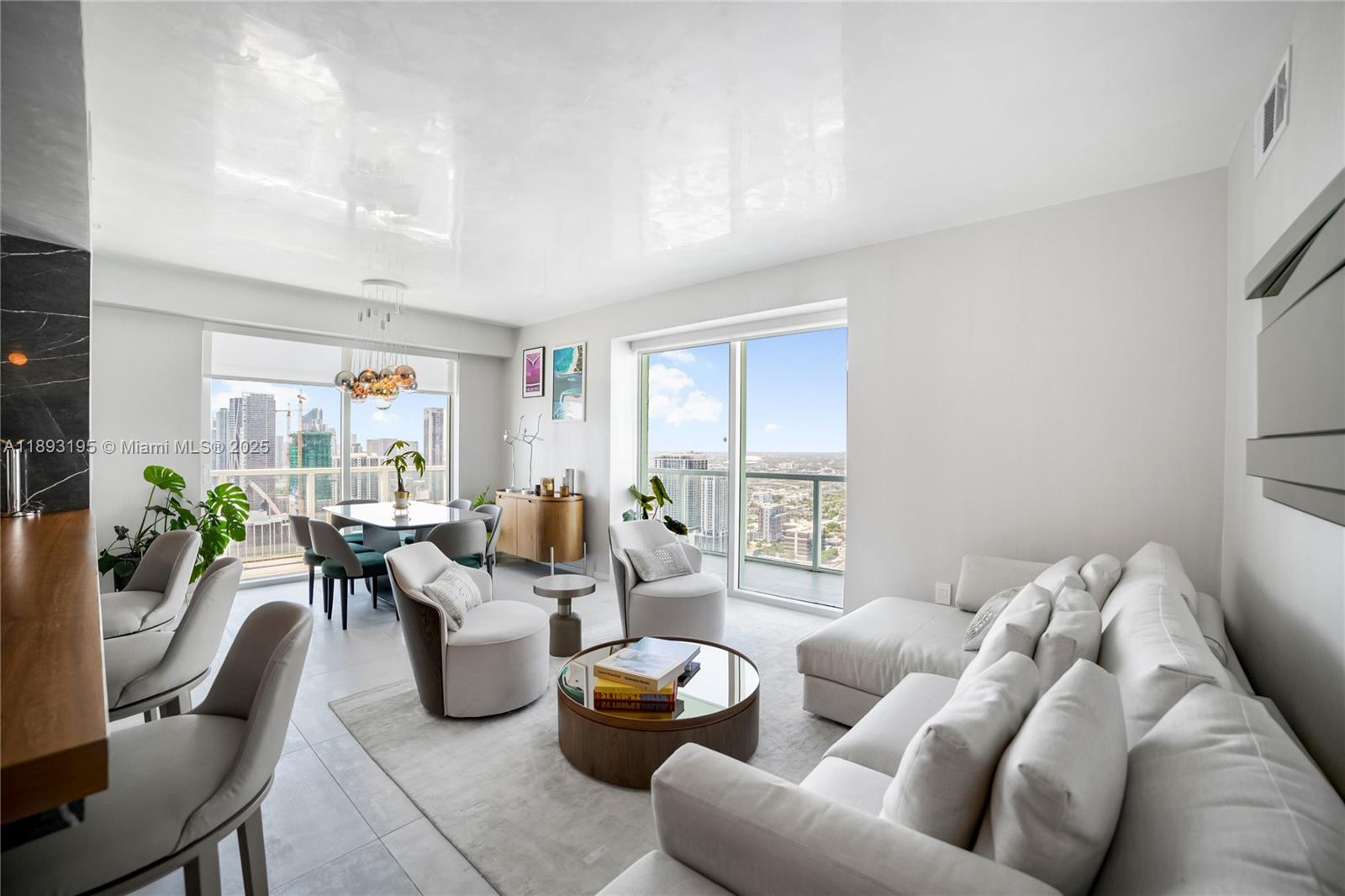 Welcome to your dream condo in Edgewater, one of Miami's most vibrant neighborhoods. Perched on the 44th floor, this stunning 2-bedroom, 2-bathroom corner unit offers panoramic views of Biscayne Bay sunrises and the city skyline at sunset. Located across from Margaret Pace Park, enjoy waterfront trails, outdoor fitness stations, a dog park, a playground, green spaces, and vibrant restaurants nearby perfect for an active lifestyle. Renovated in 2022 with high-end finishes, featuring: Custom Italian cabinetry Marble kitchen countertops Bosch appliances Built-in wine cooler Designer fixtures & furniture Includes one designated parking space. Don't miss this rare chance to live in a turnkey home with an elevated design, prime location, and luxury amenities.