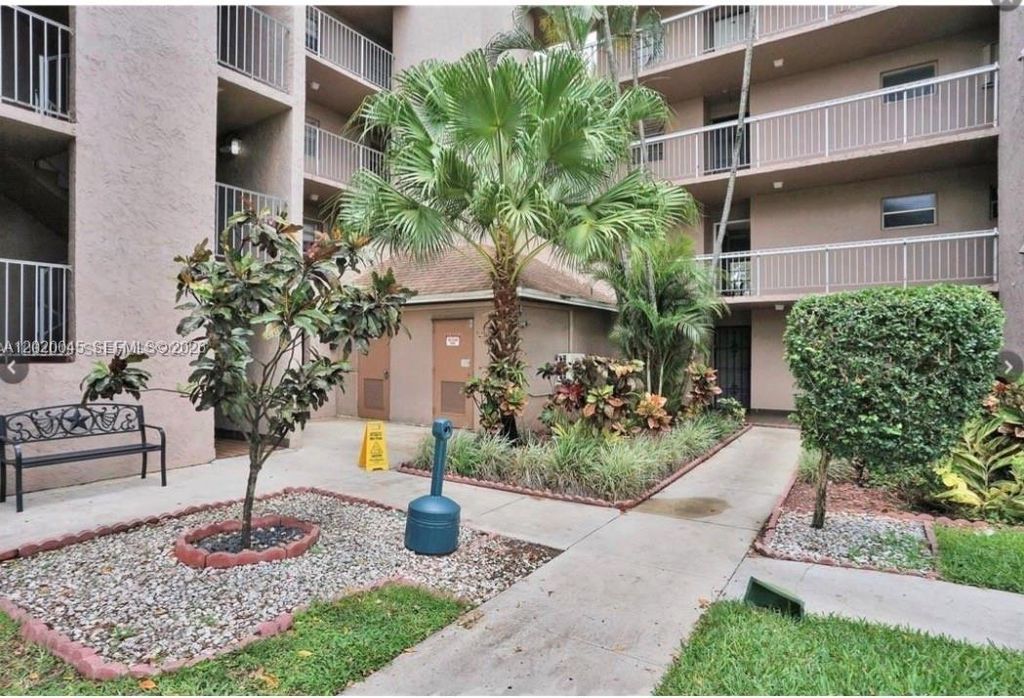 Photo of 9480 Tangerine Pl #404, Davie, FL 33324 (MLS # A12020045)