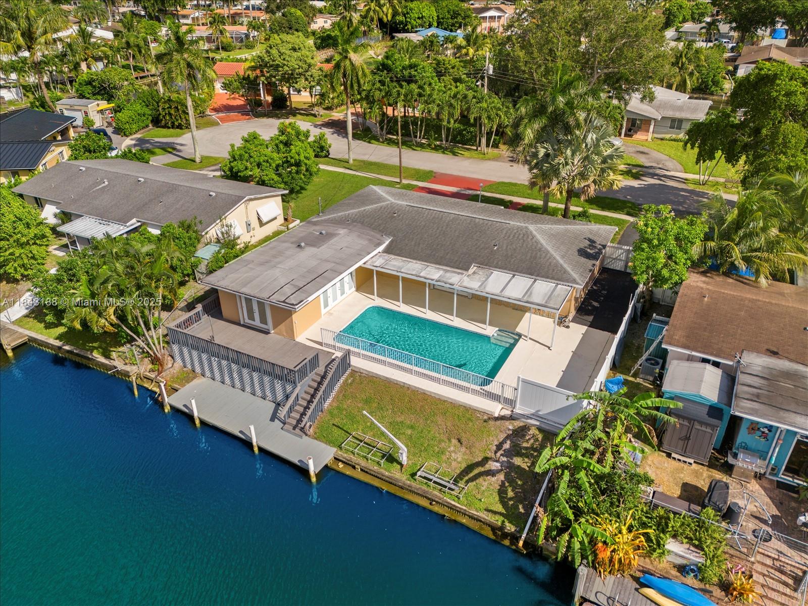 Waterfront Paradise plantation isles, Peaceful canal views from a backyard spacious covered patio for year-round enjoyment, open layout, oversized family room, stainless steel appliances, gorgeous pool 30+25 with large deck perfect for entertaining, Two driveways & fully fenced yard, boaters dream with direct ocean access via one fixed bridge bring your 30+ft boat and enjoy Tucked at the end of a quiet cul-de-sac close to school restaurant shopping and major highways.