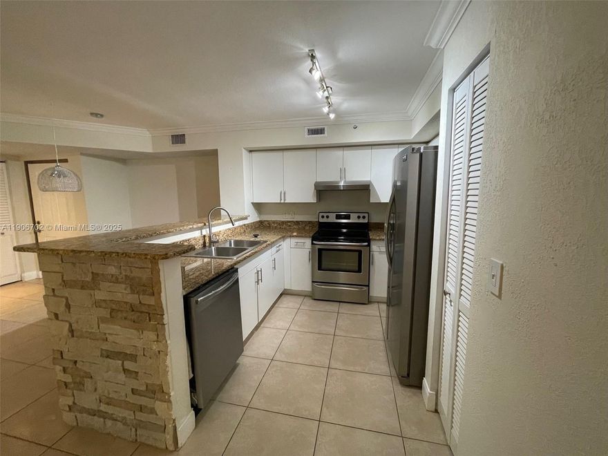 First floor 2BR/2BA condo in the Carrington gated community in Coconut Creek.  This condo is move-in ready with
all freshly painted walls, new dishwasher and  new washer/dryer.  Kitchen is updated with stainless steel appliances, white cabinets and granite countertops.  Tiled rooms throughout with spacious living and dining areas, updated bathrooms and walk in closets. Condo has HURRICANE IMPACT WINDOWS/DOORS and newer AC units inside and out. The community offers  a pool area, tennis courts, gym, and children's play area. Ideally located near top-rated schools, major highways, shops and restaurants at The Promenade in Coconut Creek.