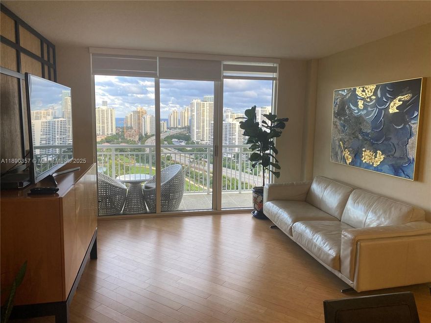 Furnished and comfortable apartament with exceptopnal view to the golf course and intracostal from the balcony and every room. Spacious 2 Beds with 2 Baths, bamboo floor, kitchen with granite counter-top, full size washer and dryer inside the unit. All the appliances and the air conditioning are new. Building features: 24/7 concierge, security, valet parking, fitness center with yoga studio, business center, conference room, game room, kids pool, BBQ, cortesy bus & more. Walking distance to Aventura Mall, easy access to the major Hwys, restaurants and city parks.