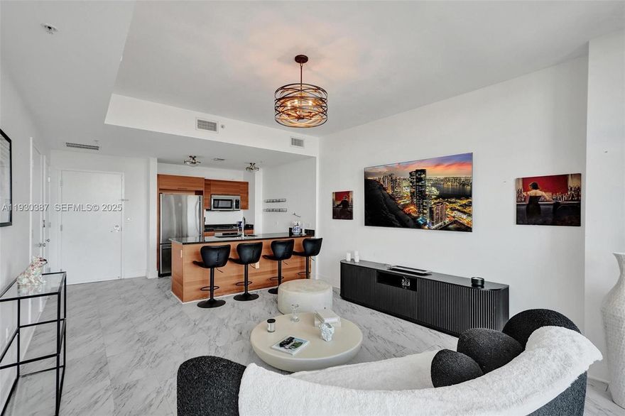 Experience modern urban living in the heart of Midtown Miami! This spacious 1-bedroom, 1.5-bath with 761 SQ FT of living space residence offers an open-concept layout with floor-to-ceiling windows that fill the space with natural light. The sleek kitchen features quartz countertops, premium stainless-steel appliances, and contemporary cabinetry — perfect for both cooking and entertaining. Enjoy a large primary suite with black out shades and a walk-in closet. The private balcony offers stunning city views, ideal for morning coffee or evening relaxation. Resort-style amenities include a pool deck, sauna, steam room, gym, and 24-hour concierge. Just steps from the best shopping, dining, and nightlife that Midtown, Wynwood, and the Design District have to offer. 1 assigned parking included. Unit is tenant occupied until April 1, 2026. Contact listing agent.