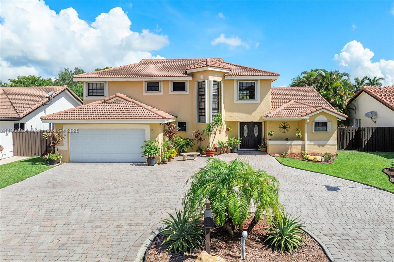 Rarely available in the Mansions of Lakes of the Meadow, this spacious home checks all the boxes. Located in a top-rated school district, this property features a first-floor primary bedroom, tile flooring throughout, and a large paver, circular driveway. The kitchen offers granite counters, wood cabinets, and stainless steel appliances. Enjoy peace of mind with accordion hurricane shutters and a 2012 roof. Additional highlights include yellow pine wood stairs, no popcorn ceilings, fans in all bedrooms, and an outdoor kitchen perfect for entertaining. Publix is just around the corner, and the low HOA offers fantastic amenities. This is the one you have been waiting for. Schedule your showing today!