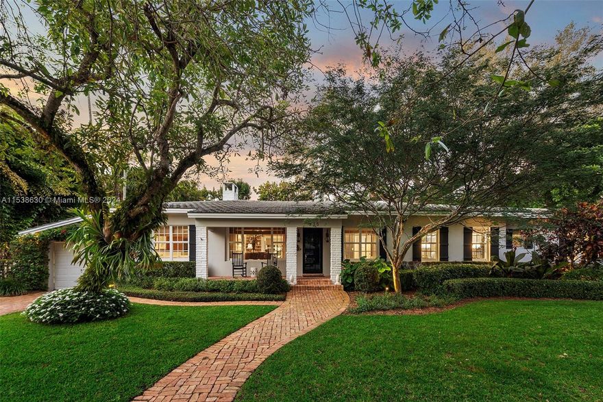 Absolutely beautiful & perfectly located in the Golden Triangle, this 5 BR, 3 BA 3,069 SF home features timeless design coupled w/ modern updates! Enter the grand formal living room w/ working fireplace & beautiful built-ins that flows seamlessly into the sun-drenched dining rm. The updated kitchen hits all the right notes w/ white cabinets, sleek counters & stainless steel appliances including gas range, & it opens to the comfortable family room – the perfect hangout spot! Ultra-serene, the primary suite includes 2 closets & a BA w/ dual vanities, sep tub & shower.  The 14,822 SF lot is lush & private w/ majestic oaks & wonderful spots for seating & dining.  Inside find 4 add’l BRs, 2 more renovated BAs, laundry, garage, oak flrs, impact windows & more.  This is the Gables at its finest!