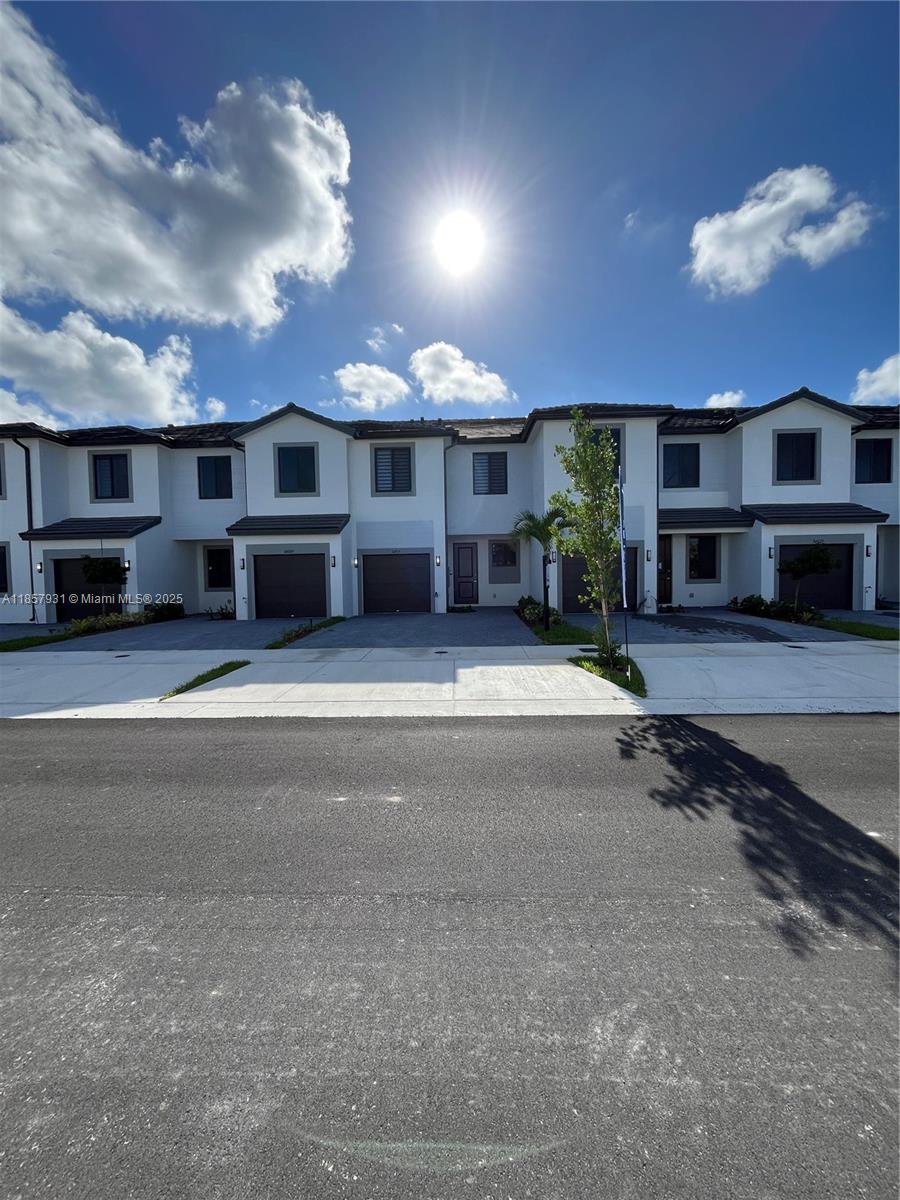 Stunning New Construction! Be the first to live in this brand-new 3-beds 2.5-bath townhome located in the highly sought-after Century Park Square community. Designed for modern living, this home boasts an open-concept layout, stylish tile floors, and a gourmet kitchen with stainless steel appliances and quartz countertops. The spacious primary suite features blackout blinds, a walk-in closet, and a spa-like bathroom. Enjoy zebra blinds throughout, in-unit washer and dryer, a private fenced patio ideal for entertaining, and a convenient 1-car garage. Live in a family-friendly neighborhood with a private park, dog park, and walkable sidewalks. Just minutes from major highways, shopping, dining, and top-rated schools, this home offers the perfect combination of comfort and convenience.