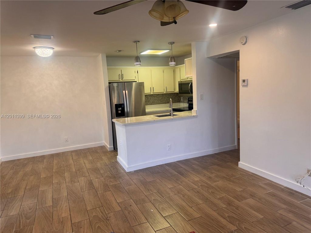 Photo of 10023 Winding Lake Rd #204, Sunrise, FL 33351 (MLS # A12011399)