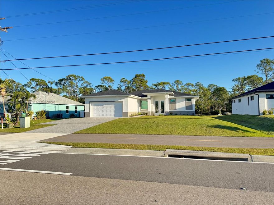 Discover this NEW CONSTRUCTION home near a Golf Course in SWFL! With nearly 1700 sq ft this residence features 3 Bedrooms + Den, 2 Baths & 2-Car Garage with epoxy floor & auto door. Inside: 10’ tray ceilings, 8’ doors, tile floors, upscale fixtures & high-impact windows/doors. The open kitchen shines with quartz counters, stainless steel appliances, soft-close cabinets & plenty of workspace. The spacious master suite offers a walk-in closet & spa-style bath with dual sinks, glass-enclosed tub & shower. Exterior highlights include paver driveway, entry & lanai, new sod, irrigation, well & septic. Generous backyard has room for a pool. Ideally located near the Seven Islands project, Burnt Store Rd & SunTrail Path for walking & biking. A modern home in a highly desirable Cape Coral location!