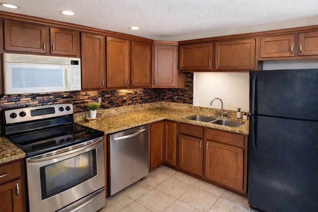 Photo of 5495 NW 10th Ct #104, Plantation, FL 33313 (MLS # A11996915)