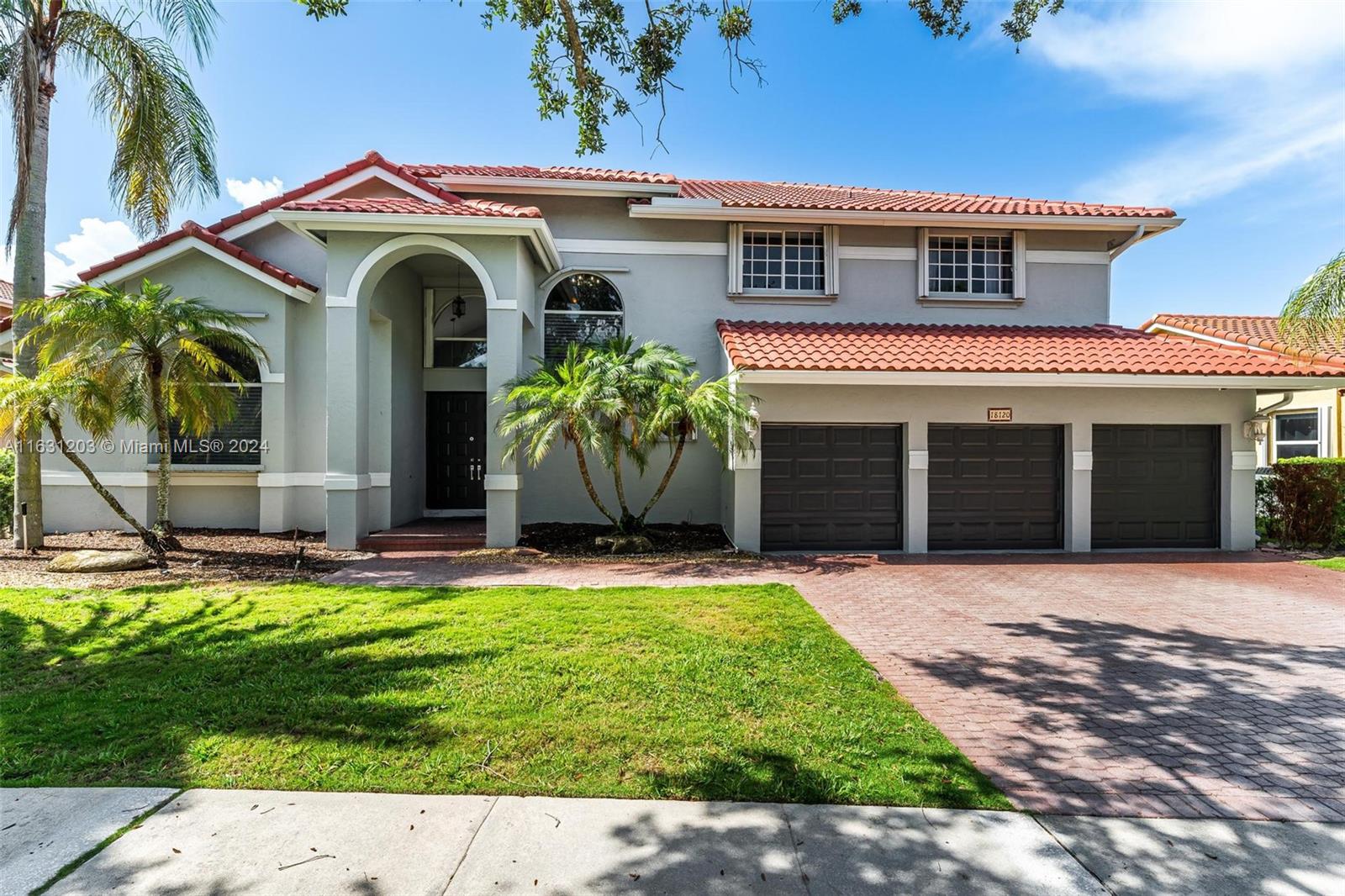 Huge 4/3.5 with bonus room, pool and lake.  Nestled in the quaint, gated Sunset Isles section of Silver Lakes with just 39 homes. Fantastic floor plan ~ big rooms & foyer entry. First floor has ensuite bedroom, 1/2 bath & handy laundry room. Primary has dual sinks & separate shower & tub. Upgrades include beautiful porcelain tile downstairs, iron/wood stair railing and wood flooring on 2nd. Bonus room can be used as office or gym. Solid wood kitchen cabinetry with quartz & stainless featuring a cooking island with sink. Step outside to a true Florida paradise. Screened & covered patio leads to big green area, sparkling pool & pretty view of lake & fountain. Insurance discounts with Roof 2021, Accordion shutters & rated garage door.  Zoned for terrific schools including West Broward High.