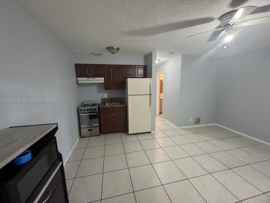 Photo of 4019 NW 31st Ave #5, Lauderdale Lakes, FL 33309 (MLS # A11977204)