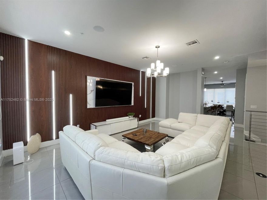 LUXURY LANDMARK DORAL, THIS STUNNING 4-STORY TOWNHOUSE! BOASTING CONTEMPORARY DESIGN AND HIGH-END FINISHES, THIS HOME OFFERS AMPLE SPACE AND MODERN AMENITIES. ENJOY A SPACIOUS OPEN-CONCEPT LAYOUT FEATURING TWO CAR GARAGE. A GOURMET KITCHEN WITH STAINLESS STEEL APPLIANCES, SLEEK CABINETRY, AND QUARTZ COUNTERTOPS. ELEVATOR. HIGH VALUME CEILINGS. IMPACT WINDOWS & DOORS. PRIVATE ROOFTOP TERRACE WITH JACUZZI, OUTDOOR KITCHEN SURROUND SOUND SYSTEM. ARTIFICIAL GRASS. PERFECT FOR ENTERTAINING OR RELAXING WHILE ENJOYING DORALS BEST SUNSETS! EACH FLOOR PROVIDES UNIQUE LIVING SPACES, WALK-IN CLOSETS. THE LANDMARK COMMUNITY OFFERS RESORT-STYLE AMENITIES SUCH AS A CLUBHOUSE, POOL, FITNESS CENTER, AND MORE. PERFECTLY SITUATED NEAR TOP-RATED SCHOOLS, SHOPPING, DINING. CALL THIS PROPERTY HOME!