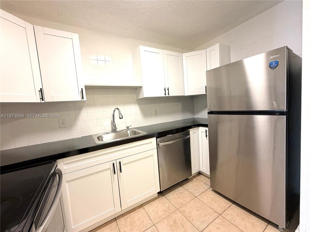 Photo of 3215 NW 102nd Ter #3215, Coral Springs, FL 33065 (MLS # A11973934)