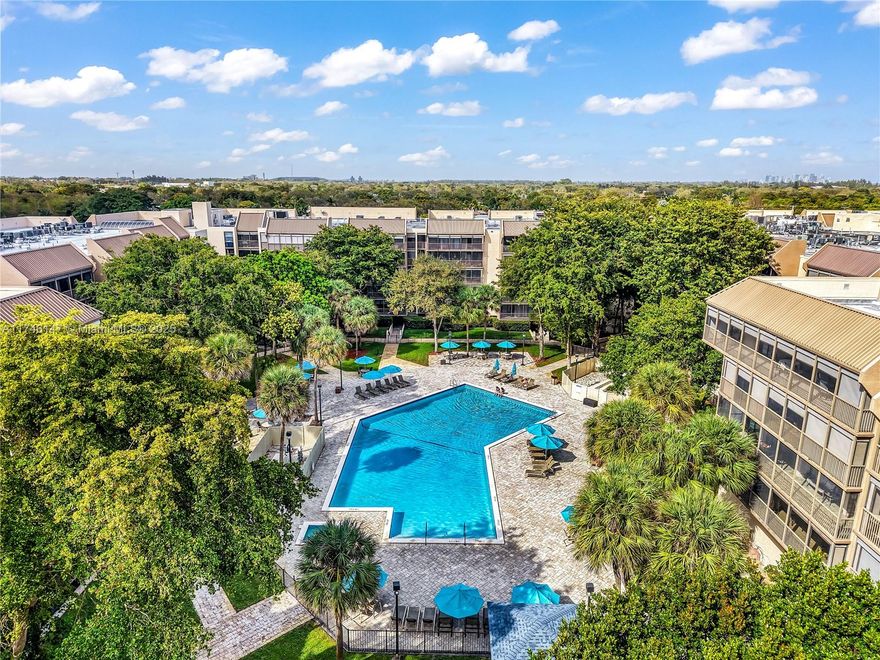 Move-in ready Monmouth-style unit with an amazing pool view! This oversized 2 bed 2.5 bath has updated floors, a built-in Murphy bed, a washer/dryer, and a separate dining room with tons of storage.  Enjoy your large balcony view of the newly remodeled heated pool and jacuzzi with BBQ and outdoor areas.  The Grandview amenities include a 24-hour guard gate, on-site property mgmt, underground parking, a gym, game, and community rooms. Centrally located to worship houses, golf courses, malls, Ft. Lauderdale airport, beaches, and much more!