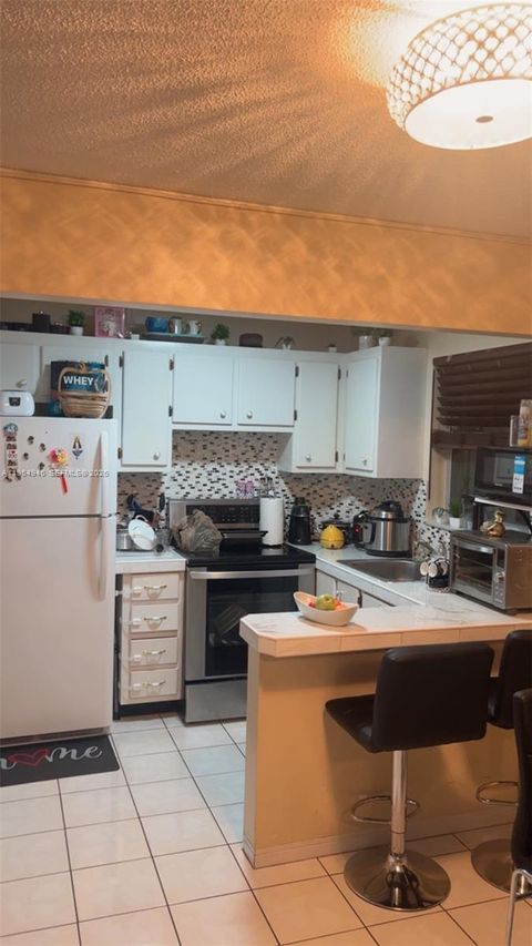 Photo of 900 Tallwood Ave #206, Hollywood, FL 33021 (MLS # A11954945)