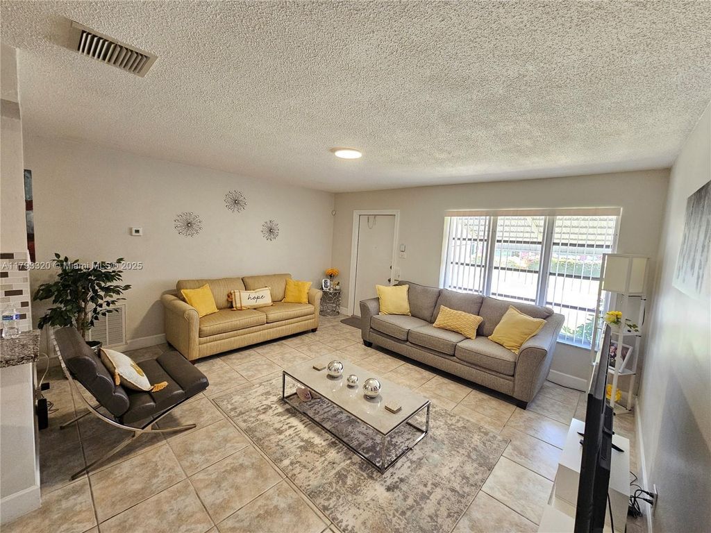 Photo of 4812 NW 49th Pl, Tamarac, FL 33319 (MLS # A11793320)