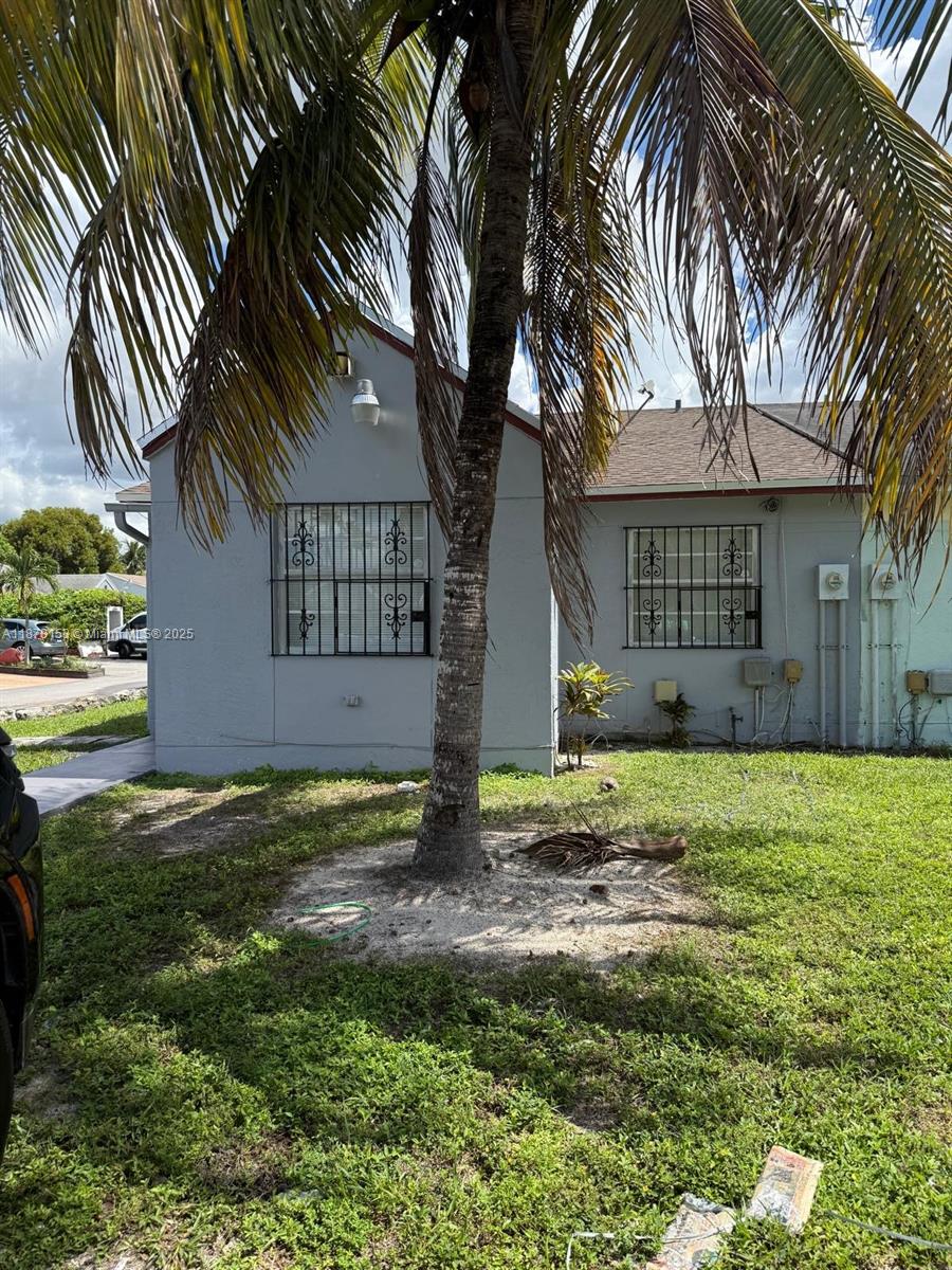 Charming and recently upgraded corner Villa. Close proximity to Florida Turnpike, Palmetto and the famous Hard Rock Stadium . This home boasts great potential, featuring 3 bedrooms and 2 bathrooms plus an independant In-Law Quarters at rear. Perfect for a starter family, FHA-friendly, A must-see in person to fully appreciate this gem. No HOA!!