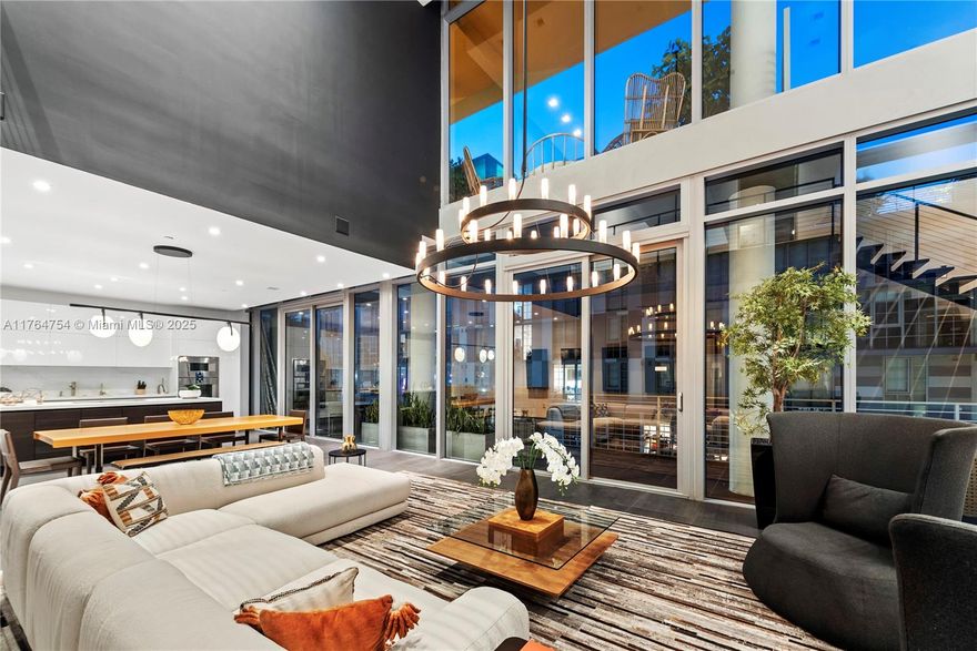 Exceptional two-level penthouse in the heart of Miami's Iconic Wynwood Art District! Conceptualized as a Modern Life Concept House for ELLE DECOR Magazine, Atico is a collaborative project of four renowned interior designers. Experience breathtaking sunset city views from this sophisticated residence which boasts 3 spacious bedrooms, 2,821 Sq.Ft. of interiors w/ original artwork by world-famous mural artists, an open floor-plan, double-height living room, & a gorgeous Scavolini kitchen with Gagganau appliances, & Caesarstone countertops. Perfect for entertaining! Enjoy 3,000 square feet of outdoor terraces, including the oversized rooftop terrace, covered in a colorful, protective canopy, with a professional bar, outdoor shower, & multiple lounging areas.