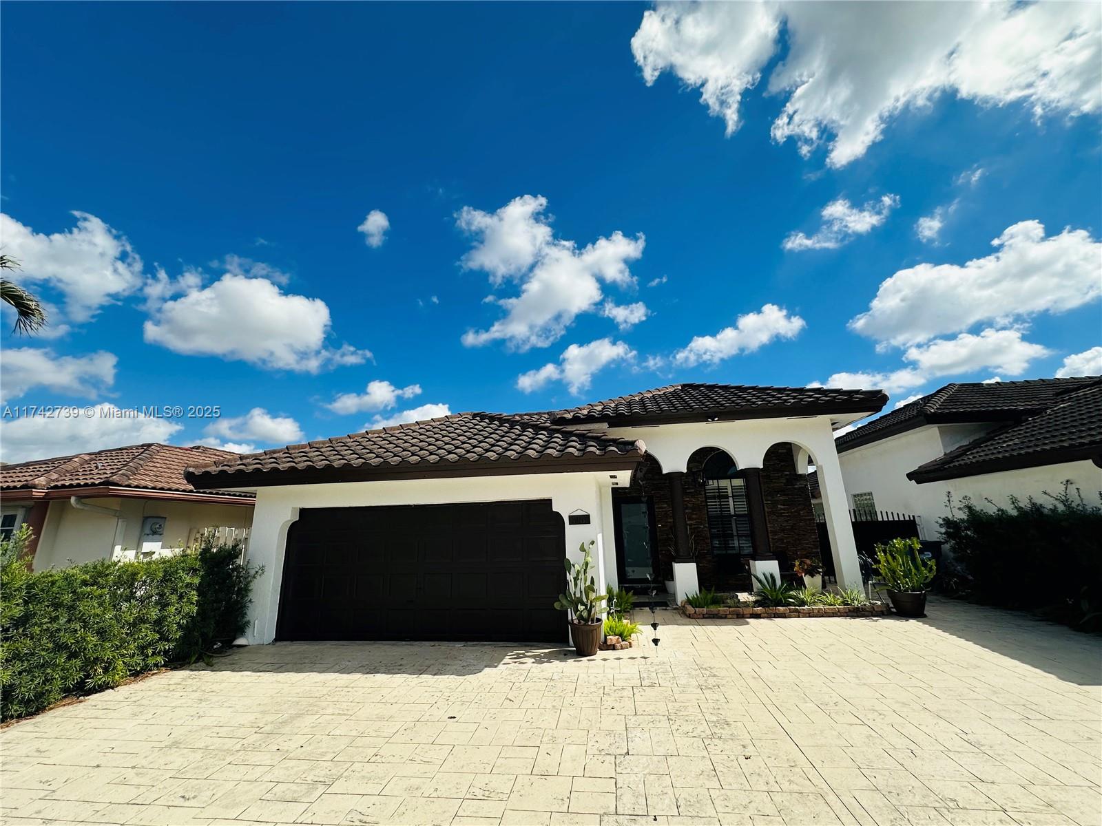 Discover this stunning 4-bedroom, 2-bathroom residence designed for comfort and style. The spacious living room boasts 10-foot-high ceilings,creating an airy ambiance,while the separate family room offers an ideal space for relaxation.The remodeled kitchen features modern finishes and ample counter space, perfect for culinary enthusiasts.Enjoy breathtaking lake views from your backyard,providing a serene retreat.With ample space to construct a pool,you can design your personal oasis.In addition to the double garage,the property includes a concrete driveway accommodating five to six additional vehicles, ensuring ample parking for family and guests.With a new roof and impeccable layout,this home is a gem you can’t afford to miss.Seize this unique opportunity before it’s gone.Contact me today